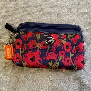 Coach floral wristlet with two zip pockets, GUC, hard to find poppy print